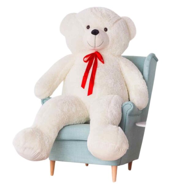 teddybeer mega zit op een stoel
